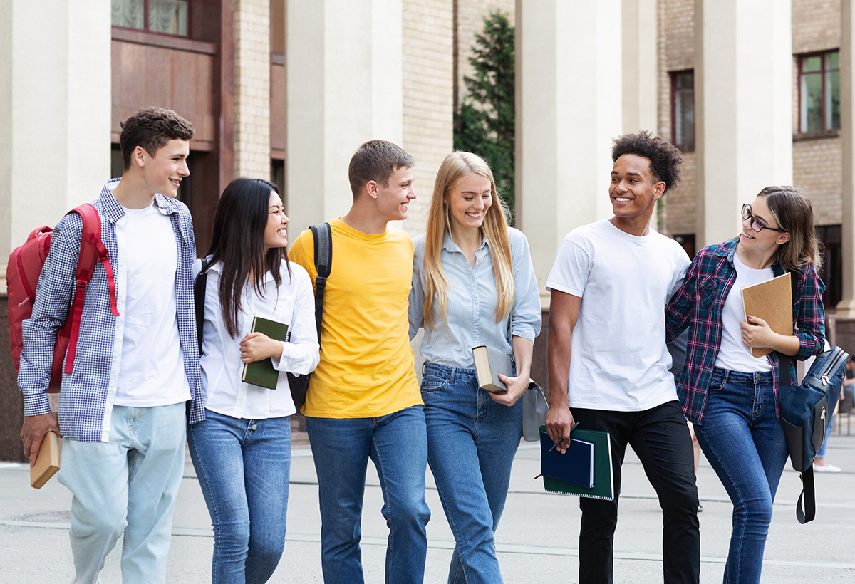 education-concept-classmates-walking-in-college-ZEKVF2P.jpg